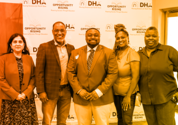 Pictured are DHA Commissioner Almas Muscatwalla, DHA President, CEO, and Board Secretary, Troy Broussard, Ontario Brown, and his parents.